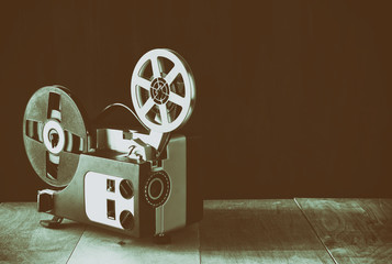 old 8mm Film Projector over wooden table