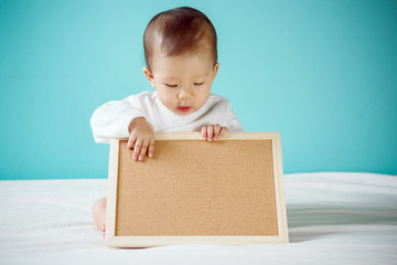 Baby with Blank Board, studio shot