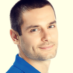 Obraz premium Portrait of cheerful young man, looking at camera