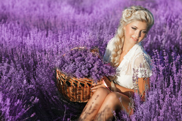 Beautiful young girl lavender flowers field