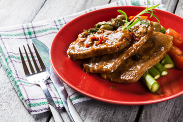 Pork chop with sauce and asparagus
