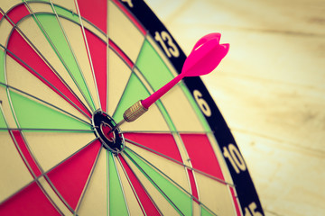 Dartboard on wood wall (Darts Hit Target)