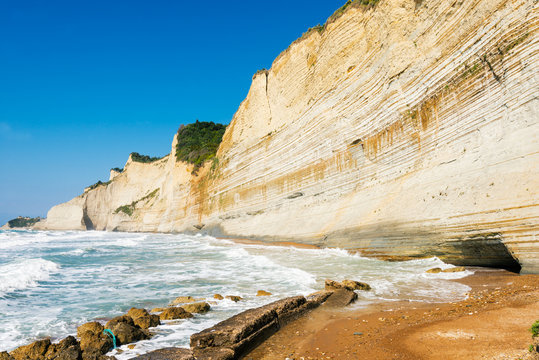 Coastline on Logas Sunset beach, Perulades, Corfu island, Greece in sunny day