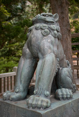 Fototapeta na wymiar Komainu statue at a temple In Tokyo, Japan