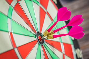 Dartboard on wood wall (Darts Hit Target)