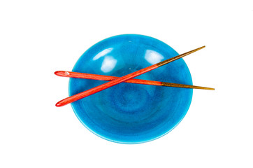 Fototapeta na wymiar empty blue bowl with chopsticks on white background