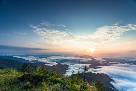 sunset scene, mountain with sea of mist at Pha Tang, Chiangrai,