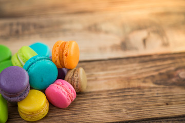 French colorful macarons on wood table