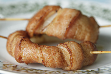 Grill Onion wrapped in bacon.