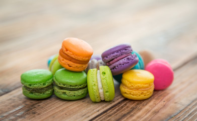 French colorful macarons on wood table