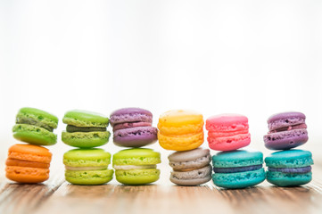 French colorful macarons on wood table