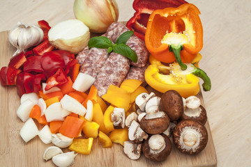 Chopped vegetables and sausage.