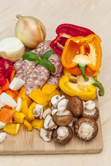 Chopped vegetables and sausage.
