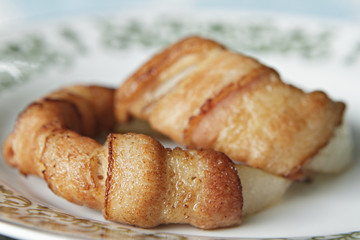 Grill Onion wrapped in bacon.