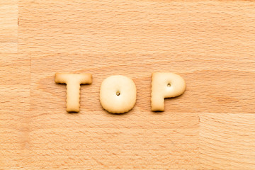 Word top cookie over the wooden background