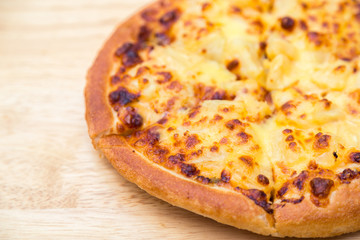 Pizza on wooden background