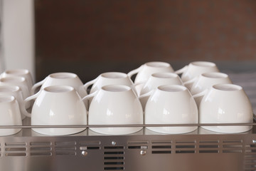 Empty coffee cup on coffee machine