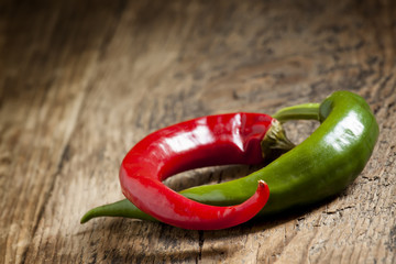 Red and green chili peppers, selective focus
