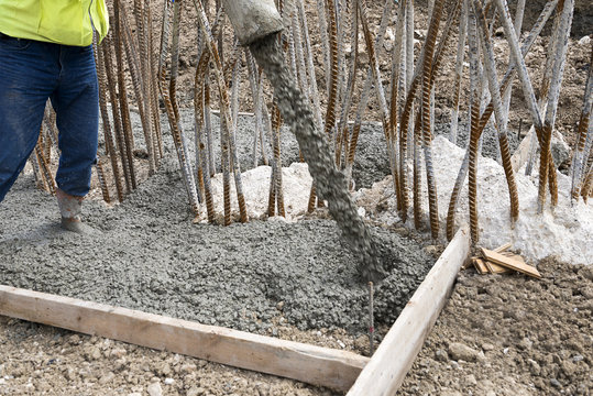 Worker Pouring Concrete