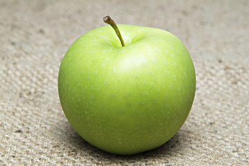 Green apple on sack.