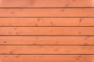 Wooden texture of brown color with scratches and cracks, which can be used as a background