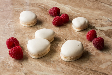 white marshmallows with ripe red raspberries