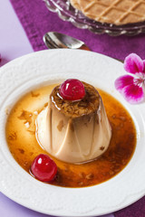 Panna cotta with cheries, caramel and wafer