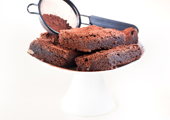 Chocolate cake brownies on a light background
