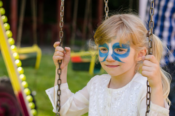 blond girl with facepainting