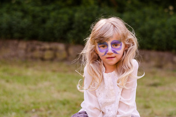 blond girl with facepainting