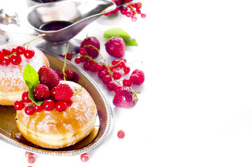 Morning breakfast with mini donuts and berries
