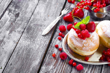 Morning breakfast with mini donuts and berries