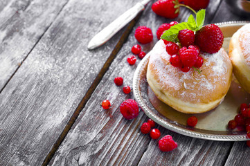 Morning breakfast with mini donuts and berries
