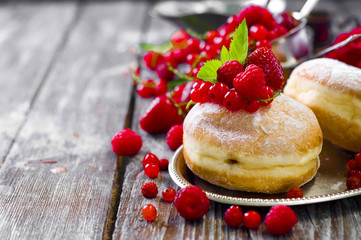 Morning breakfast with mini donuts and berries