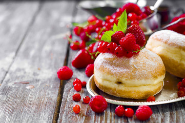 Morning breakfast with mini donuts and berries