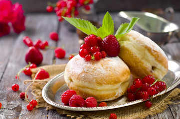 Morning breakfast with mini donuts and berries