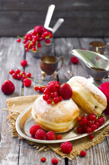 Morning breakfast with mini donuts and berries