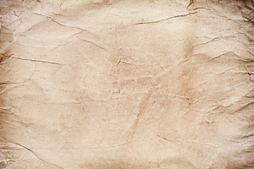 Old grungy stained paper background or texture.