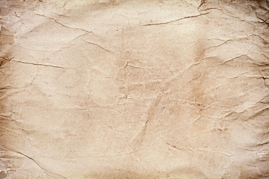 Old grungy stained paper background or texture.