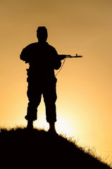 silhouette of a soldier with a gun