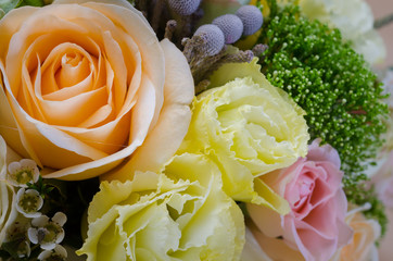 a bridal bouquet of flowers in pastel colors