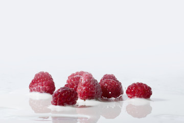 Raspberries Falls Into Milk