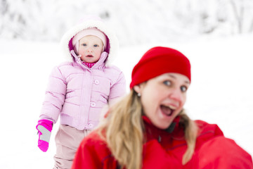 Fototapeta premium portrait of mother with little daughter in winter