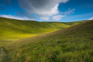 Rolling hills with blue sky with clouds