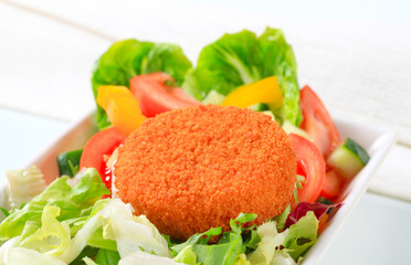 Fried cheese with vegetable salad