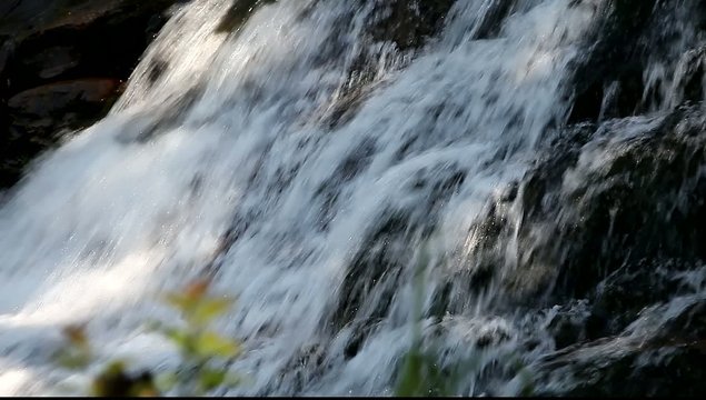 Mountain creek water flowing rapidly river cascade