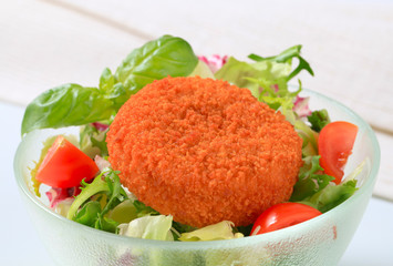 Fried cheese with green salad