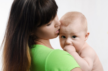 young mother kissing her baby
