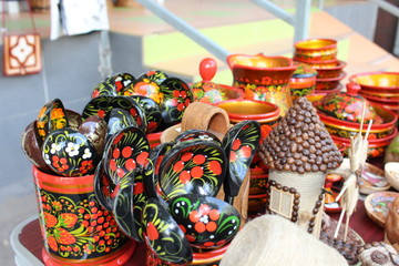 Fototapeta na wymiar Handmade products on the table. Handmade products in national style put on sale.
