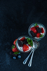 Homemade fresh parfait on black background